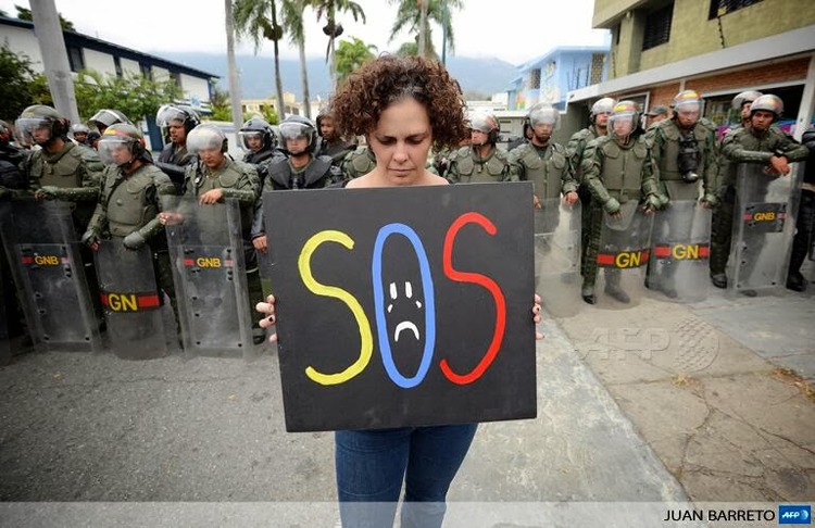 Demonstrator in Cuba - Image via Cuban Exile Quarter.jpg