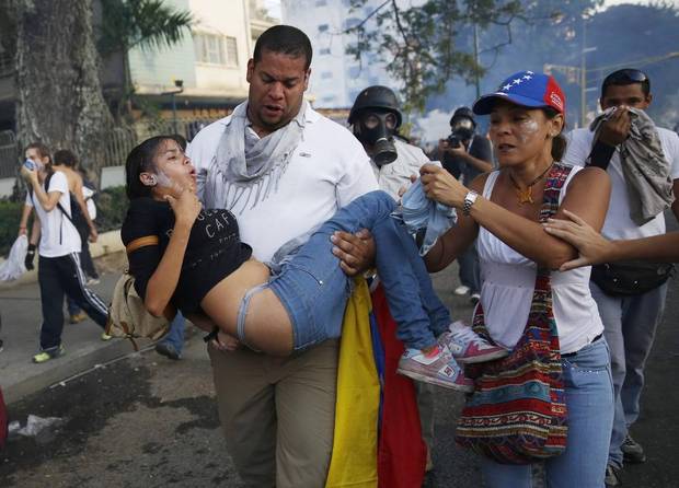 Demonstrators in Venezuela - Image via The Globe and Mail.JPG